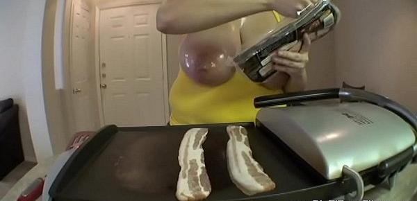  1187633 teen with huge natural 38f breasts cooks bacon and eggs